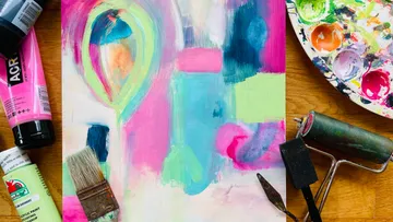 Colorful image, scattered brushes, color palette, creative environment.