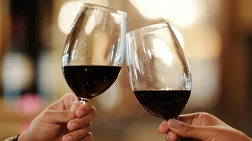 Toast two glasses to celebrate joy.