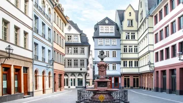 Brunnen is located on a quiet street surrounded by historic buildings.