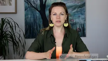 Woman talking and gesturing against an abstract background.