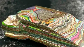 Colourful mineral formation shows vivid colors and layers.