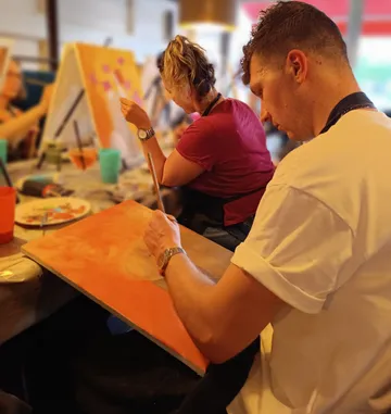 People painting in an art studio.