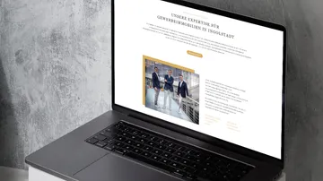 Laptop shows website about commercial real estate in Ingolstadt.