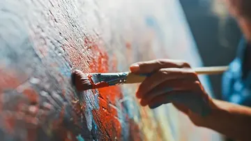 Brush paints the canvas with bright colors.