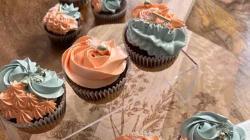 Colourful cupcakes stand on a transparent stand