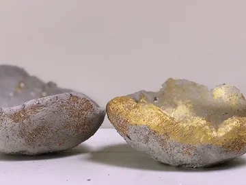 Two trays with gray concrete and gold finish.