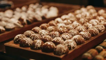 Chocolate on wooden trays, presented in a decorative and delicious way.