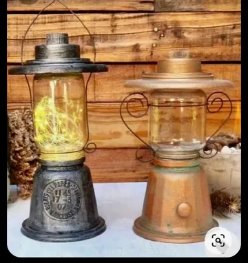 Two decorative lanterns on wooden background.