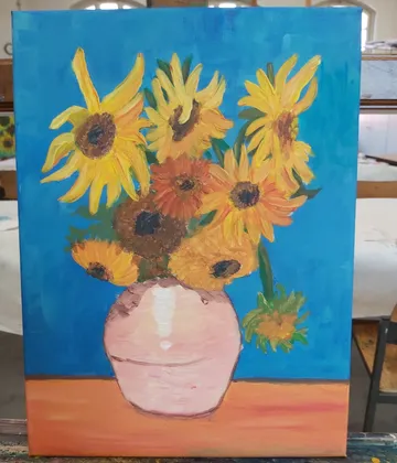 Bouquet of flowers in vase, bright colors on a blue background.