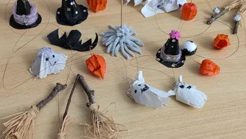 DIY Halloween decorations on wooden table.