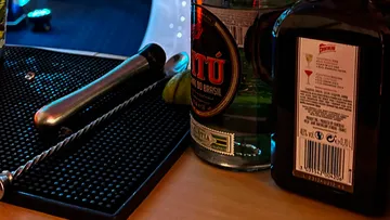 Bar tools and bottles on counter