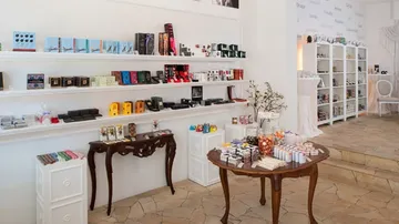 Shelf with various products; in an elegant shop.