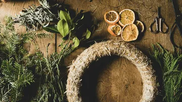 Wreath-making materials on wooden table