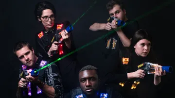 Five people aim at each other with toy laser guns.