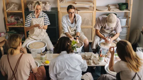 Group making pottery in a studio.