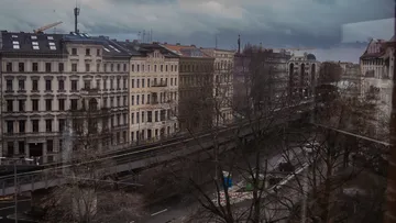 City view with grey sky and historic buildings.