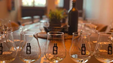 Glasses are placed on a table in a cozy room.
