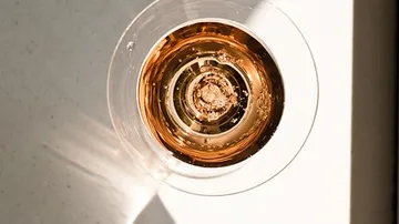 Top view of a glass of rose wine.