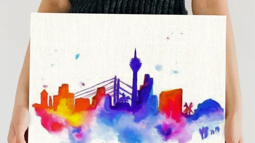 Person holding colorful cityscape painting.