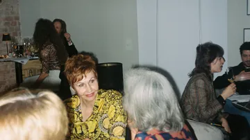People socializing at a party setting.