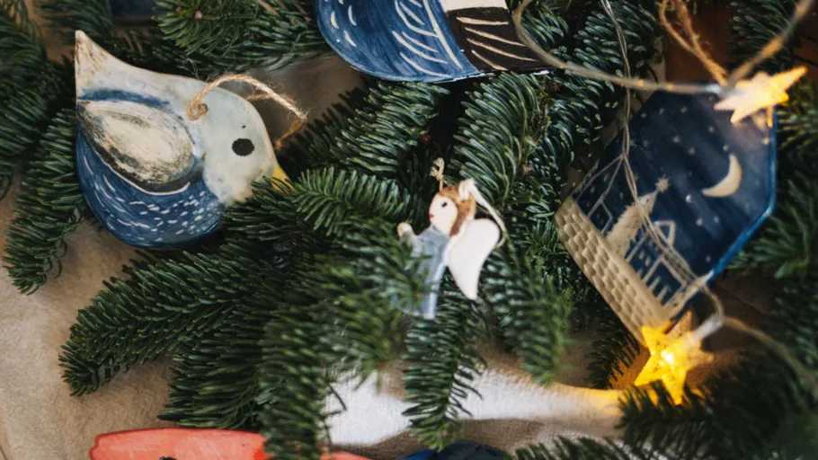 Christmas tree with handmade ornaments and star lights.
