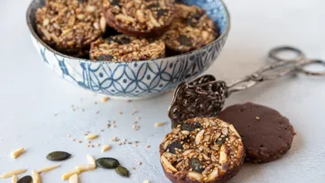 Nut and seed cookies in blue bowl.