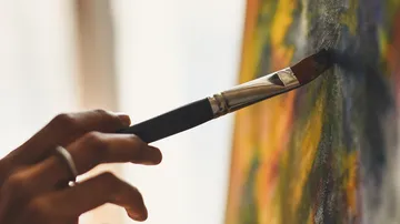 Handmalerei auf Leinwand mit Pinsel.