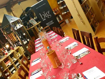 A long table in a wine shop for wine tasting.