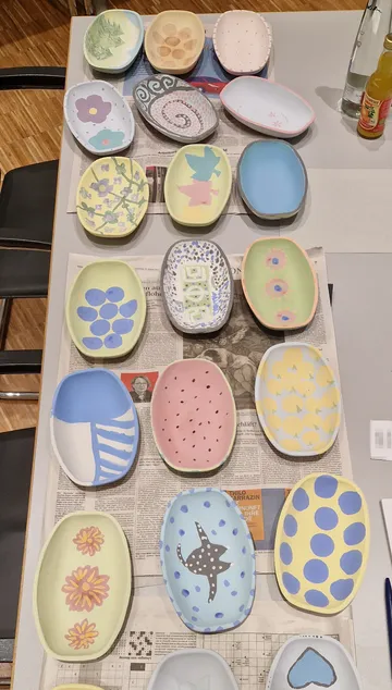 Colorful painted ceramic plates on a table.