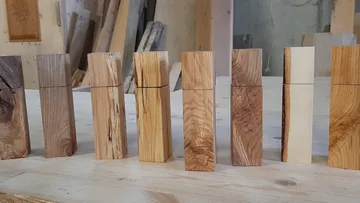 Wooden blocks with varied wood grain on table.