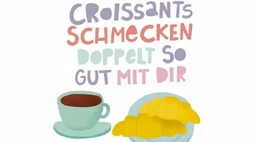 Kaffeetasse und Croissants mit deutschem Text.
