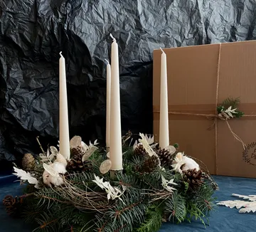 Advent wreath with candles and pinecones