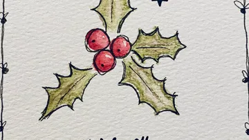 Drei Stechpalmenblätter mit roten Beeren