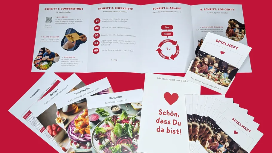 Food-themed booklets and cards on red background.