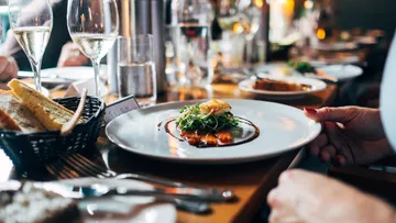 Elegant restaurant setting with gourmet dish.
