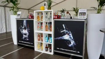 Bar counter with Bacardi bottles and decorations.