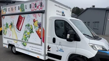 Cocktail truck parked with vibrant designs.