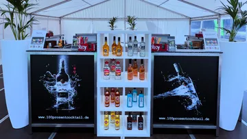 Outdoor cocktail bar with Bacardi branding.