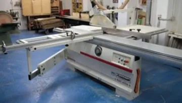 Sliding table saw in a workshop.