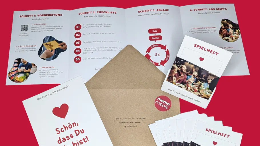Meal preparation guidebook and cards on red background.