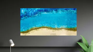Abstract ocean painting on wall with lamp.