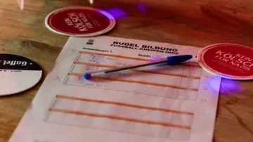 Quiz answer sheet with pen on table.