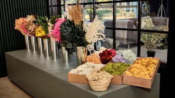 Colorful flowers and moss arranged on a display table