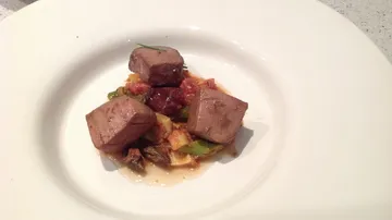 Three chunks of meat on vegetable medley.