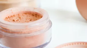 Loose powder in a clear container.
