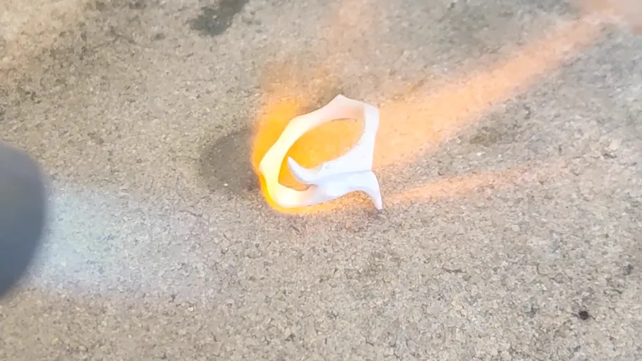 White ring melting and burning on pavement.