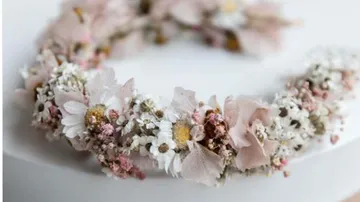 Floral wreath with pink and white flowers.
