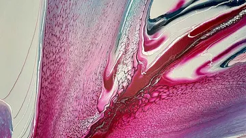 Abstract swirling pink and white paint art.