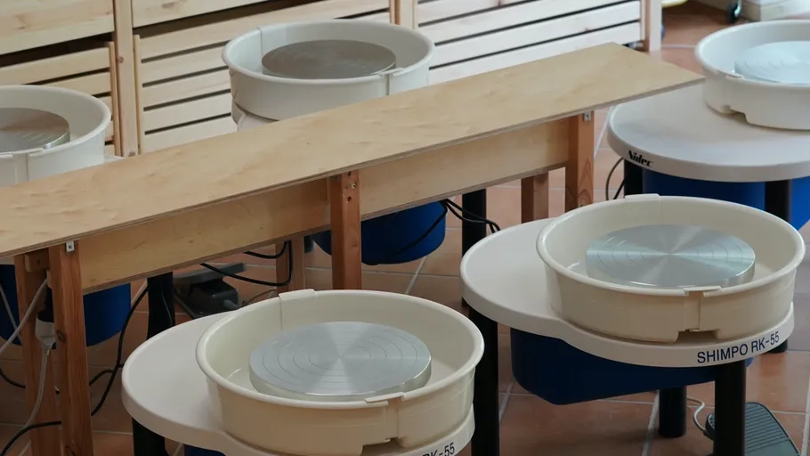Pottery wheels in an art studio setting.