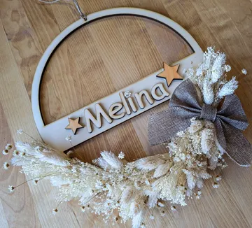 Decorative wooden plaque with name 'Melina', star, flowers.
